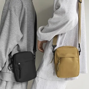 2023 Модни жени платно рамо чанти корейски плътен цвят Оксфорд студент телефон чанта чанта малък пратеник Crossbody торбичка